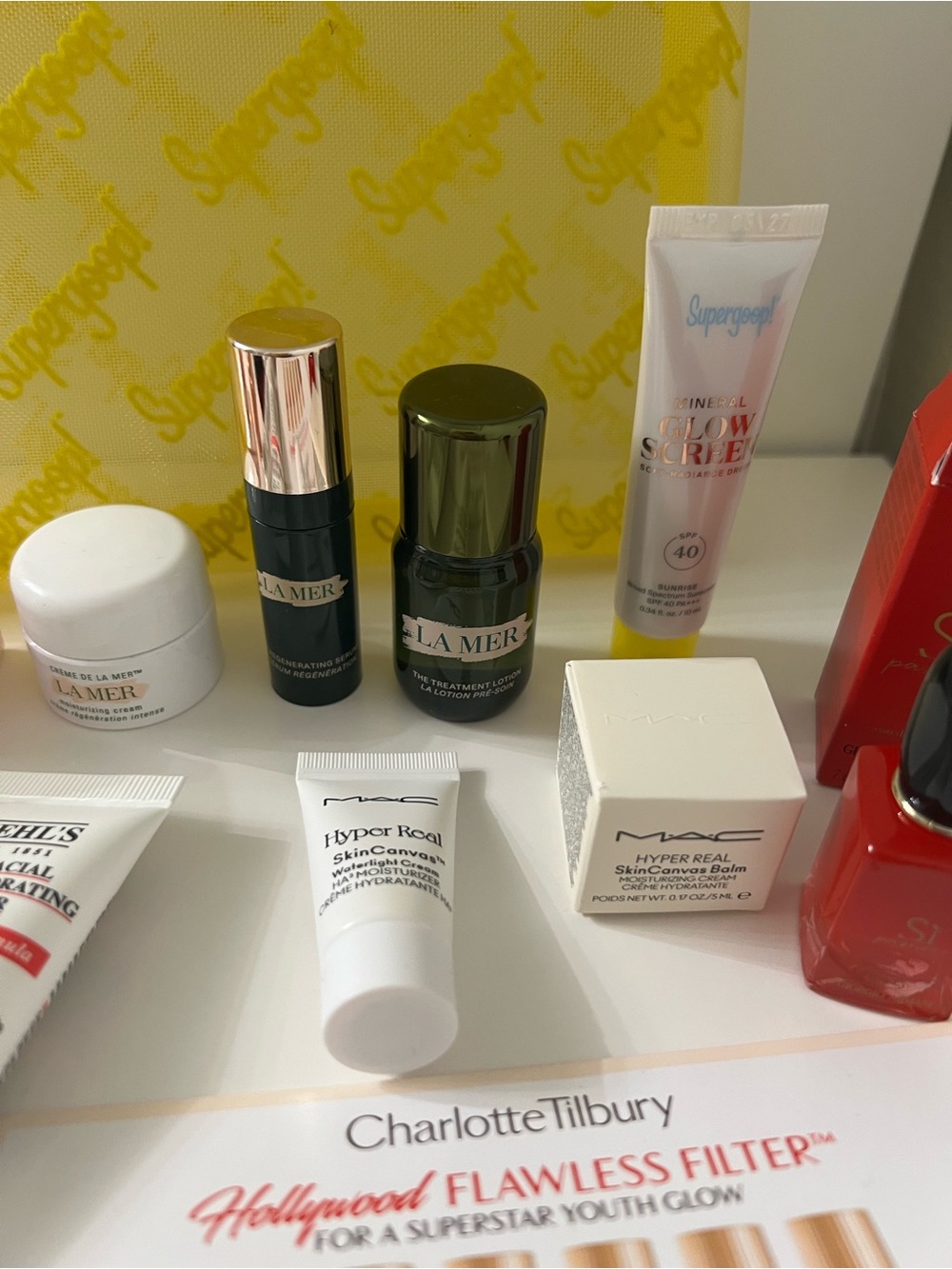 Supergoop! New Yellow Mesh Travel Pouch with mini skin care fsamples bundle. - Picture 4 of 8